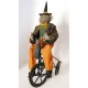 Vintage Primitive Folk Art HALLOWEEN GREEN WITCH on TRIKE by Sylvia Carlson.